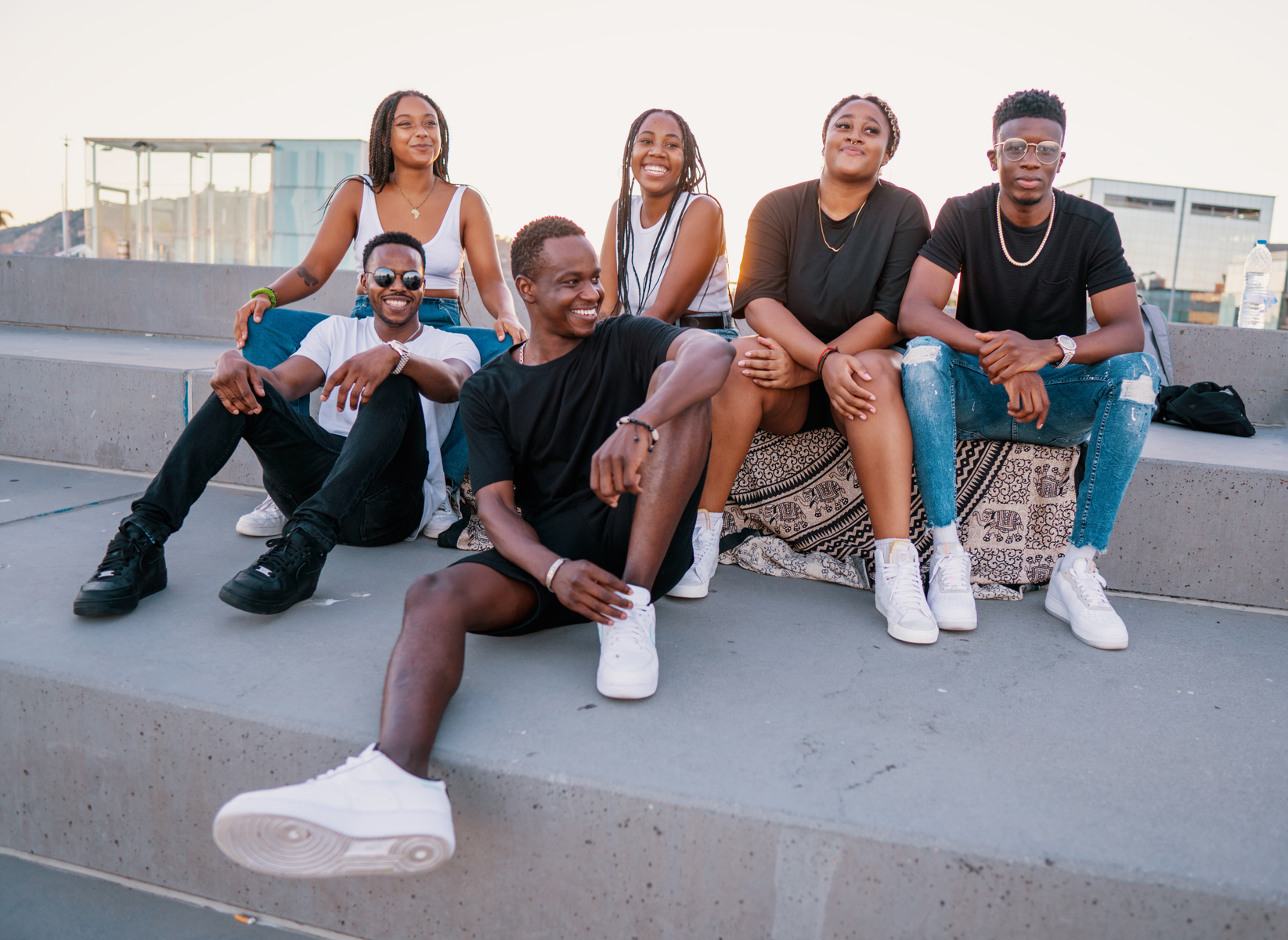 A diverse group of young people sitting together outdoors